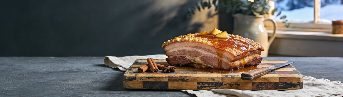 Mitch's Preserves Apple Spice Jelly: Roast pork belly with crackling glazed in apple spice jelly on a butcher's block