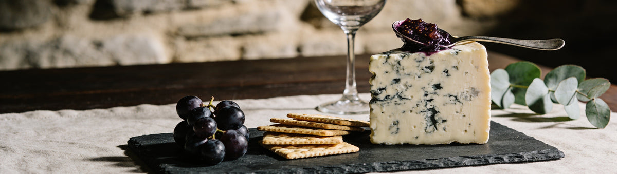 Mitch's Preserves Fig & Shiraz Paste: Blue cheese wedge topped with fig and shiraz paste with crackers and grapes