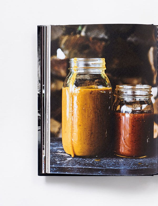 Myron Mixon's BBQ Rules by Myron Mixon hardback cookbook — interior page of homemade barbecue sauces in jars