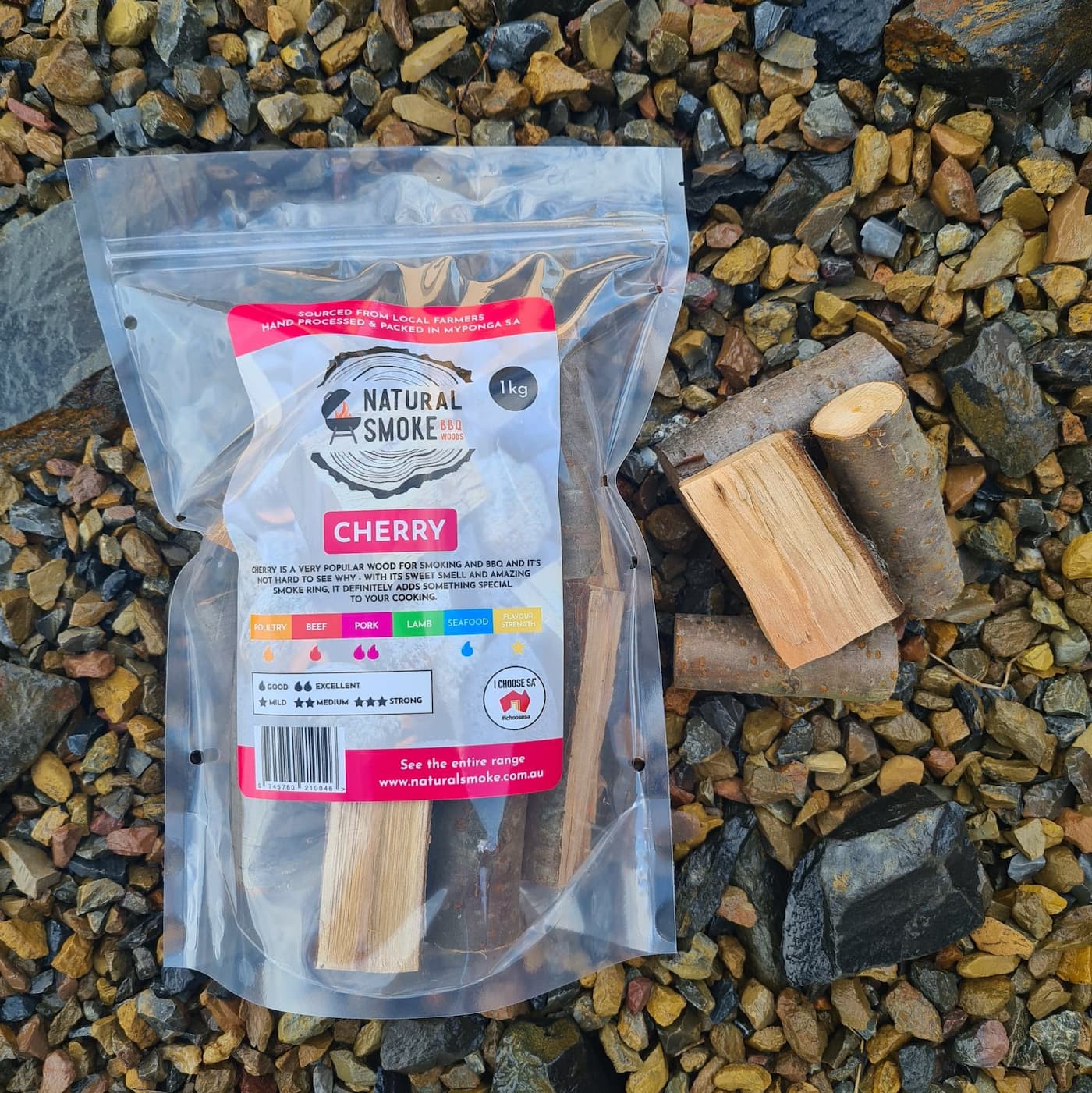 Natural Smoke BBQ Woods Cherry wood chunks 1kg bag on location with raw wood chunks