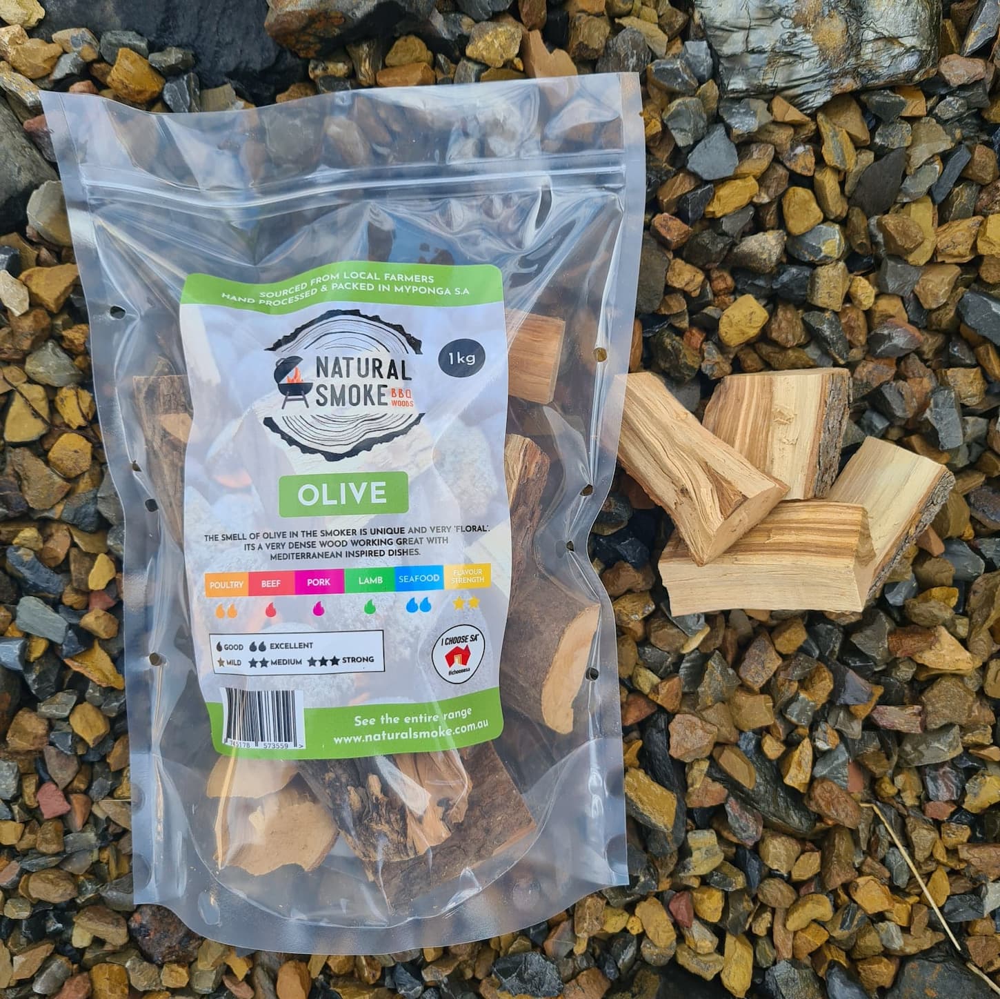 Natural Smoke BBQ Woods Olive wood chunks 1kg bag on location with raw wood chunks