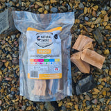 Natural Smoke BBQ Woods Peach wood chunks 1kg bag on location with raw wood chunks