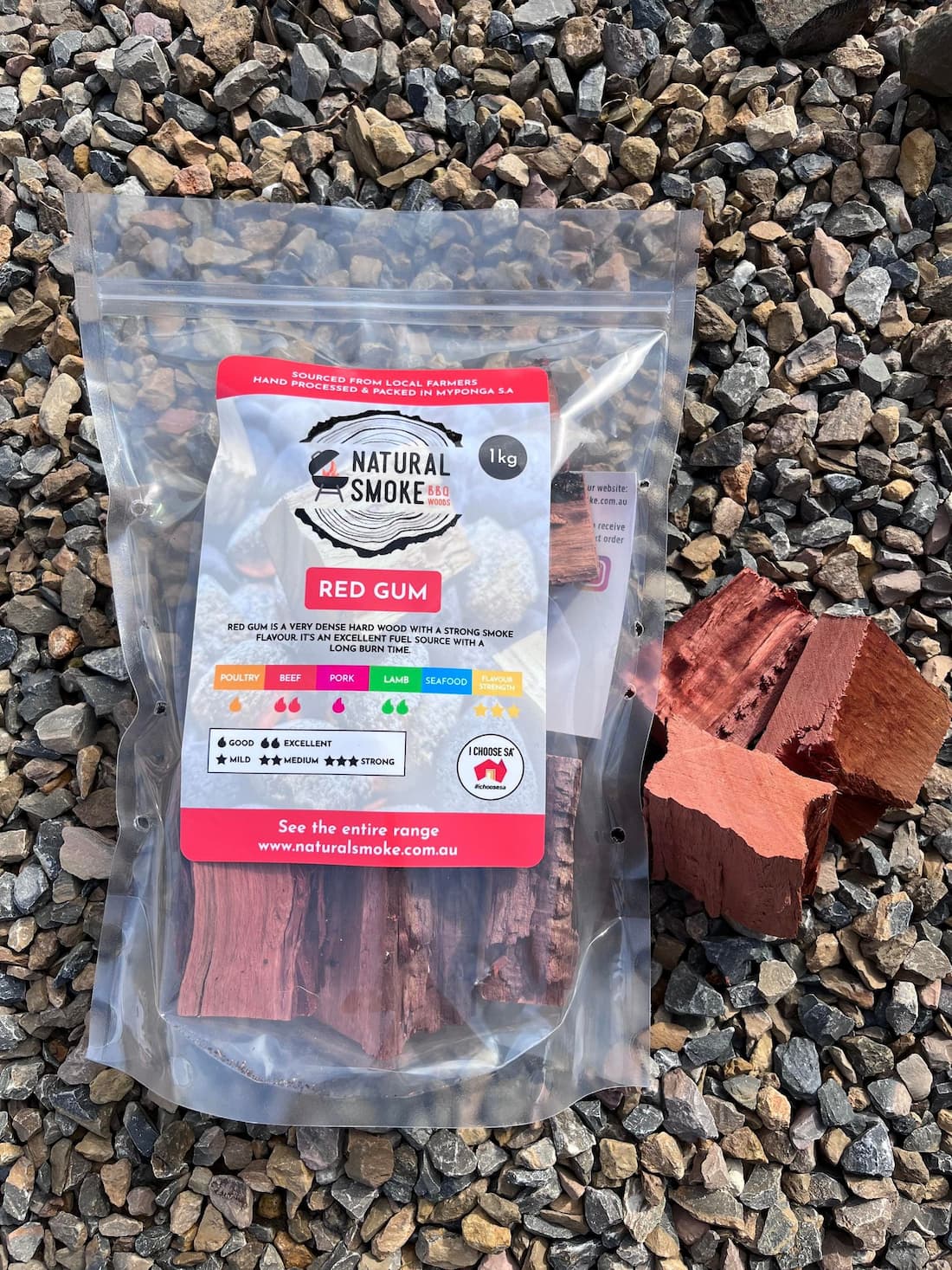 Natural Smoke BBQ Woods Red Gum wood chunks 1kg bag on location with raw wood chunks