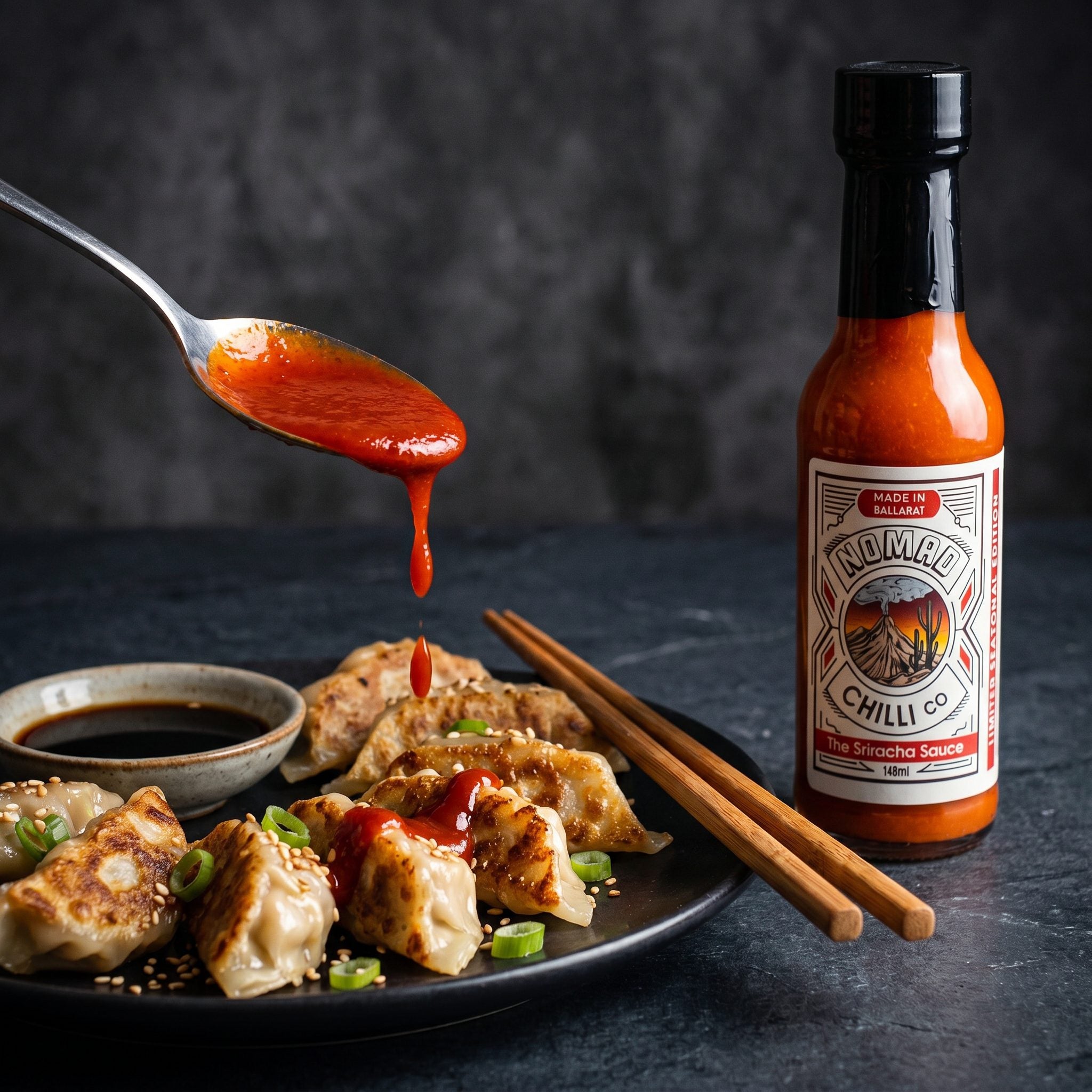 Nomad Chilli Co The Sriracha Sauce — red sriracha spooned over pan-fried gyoza dumplings