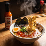 Nomad Chilli Co The Sriracha Sauce — sriracha swirled through a steaming bowl of ramen