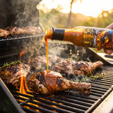 Fire Of The Phoenix hot sauce drizzled over Caribbean jerk chicken on the grill