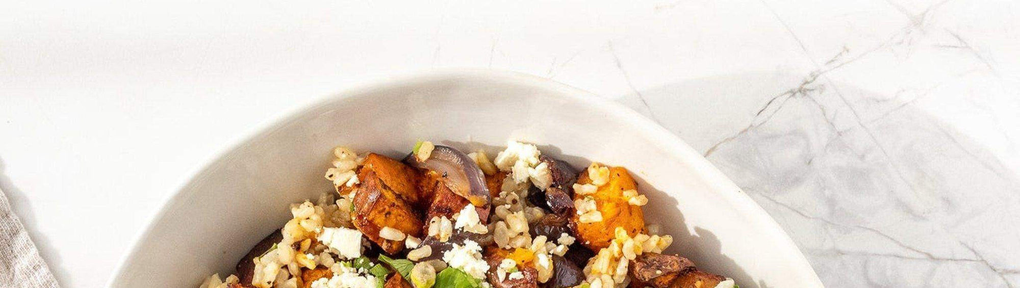 Rum and Que Bull Dust All Purpose Rub banner — roast pumpkin and grain salad in a white bowl