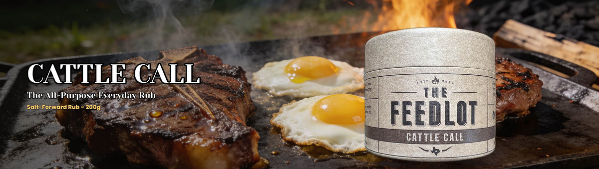The Feedlot Cattle Call Rub 200g banner — seared steak and fried eggs on a smoky griddle