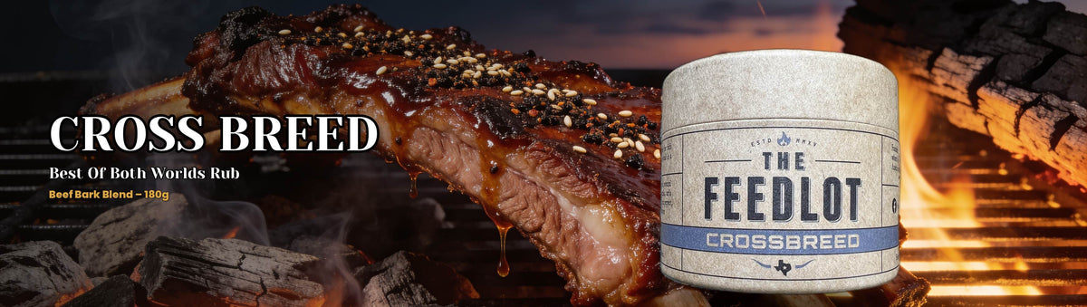 The Feedlot Cross Breed Rub 180g banner — glazed sesame-crusted beef short ribs on the grill
