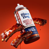 Blues Hog Sizzlin' Heat BBQ Sauce with grilled ribs