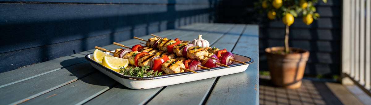 Garlic, lemon and herb chicken skewers on a verandah table, marinated in Smoke on Wheels BBQ Marinade
