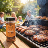 Smokes The Standard all-purpose BBQ rub — backyard grill with sausages, burgers and steaks searing