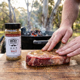 Smoky Pastures Risk It rub — beef scotch fillet hand-seasoned at a backyard grill
