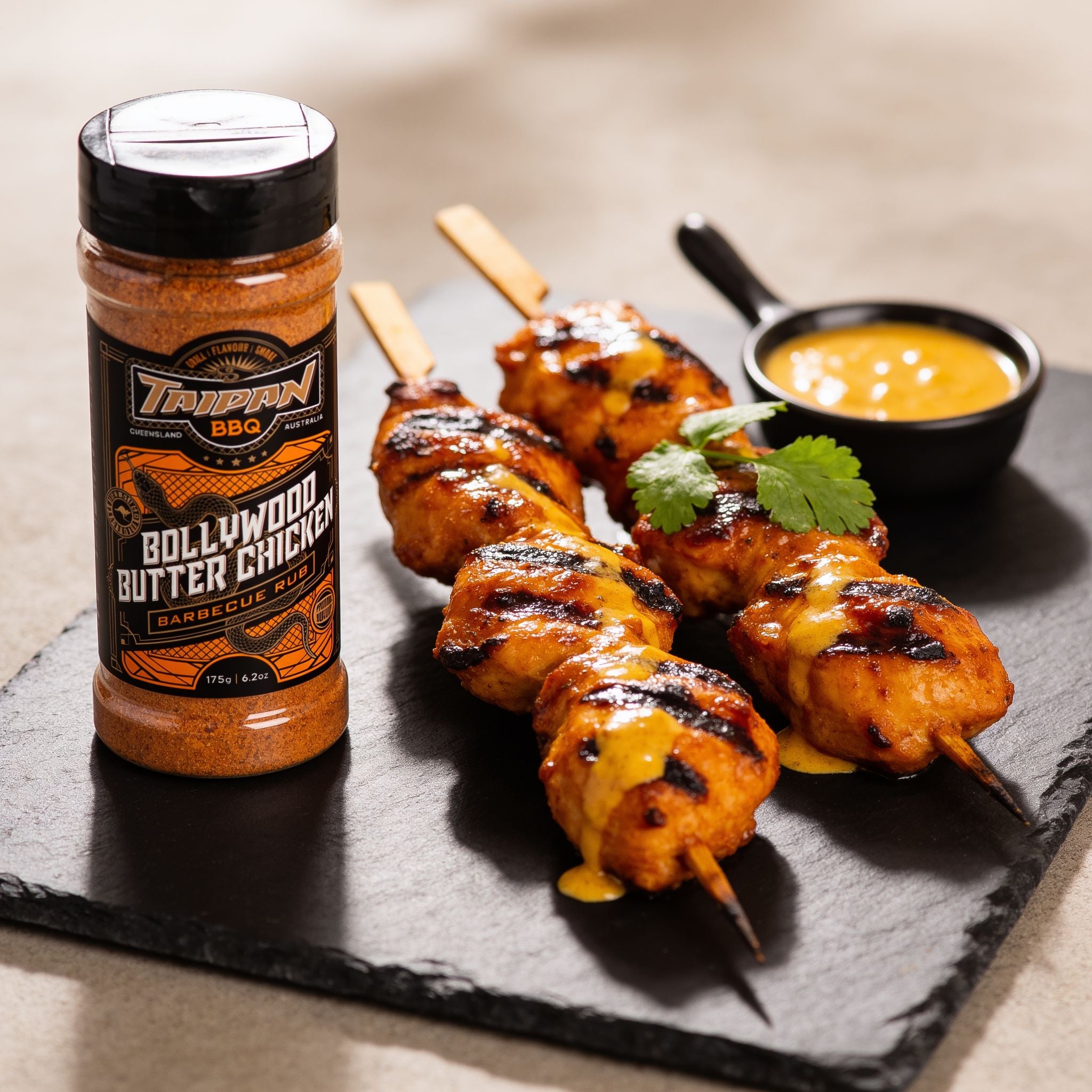 TAIPAN BBQ Bollywood Butter Chicken spiced chicken BBQ rub 175g — beauty shot, glazed grilled chicken skewers with buttery spiced sauce