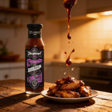 TAIPAN BBQ Bubblegum ultra hot 7 pot chilli BBQ sauce 250ml — action shot, sauce drizzling over wings mid-air