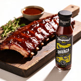 TAIPAN BBQ Oaxaca mild smoky-sweet BBQ sauce 250ml — beauty shot, glazed sticky ribs glistening with sauce