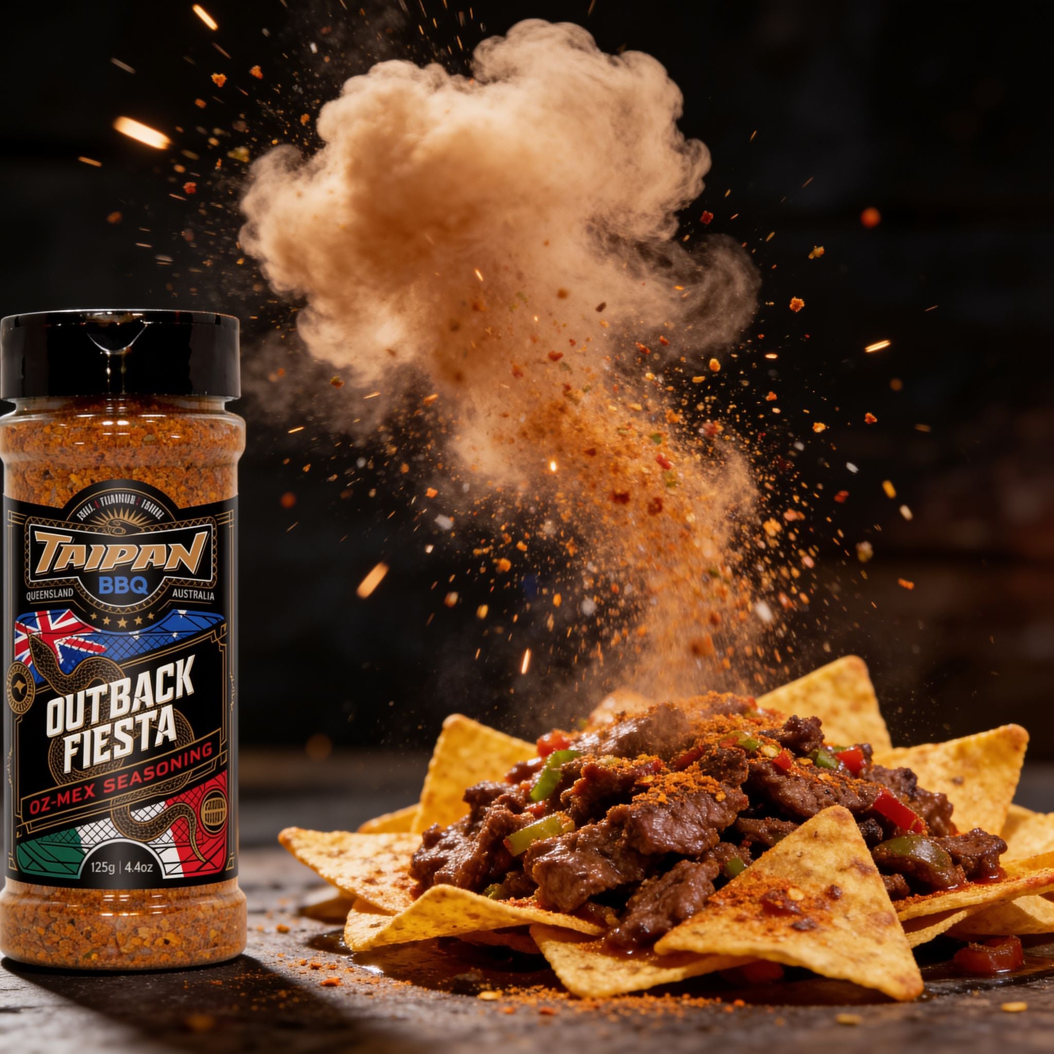 TAIPAN BBQ Outback Fiesta Oz-Mex seasoning 125g — action shot, seasoning cloud freeze-frame over beef nachos