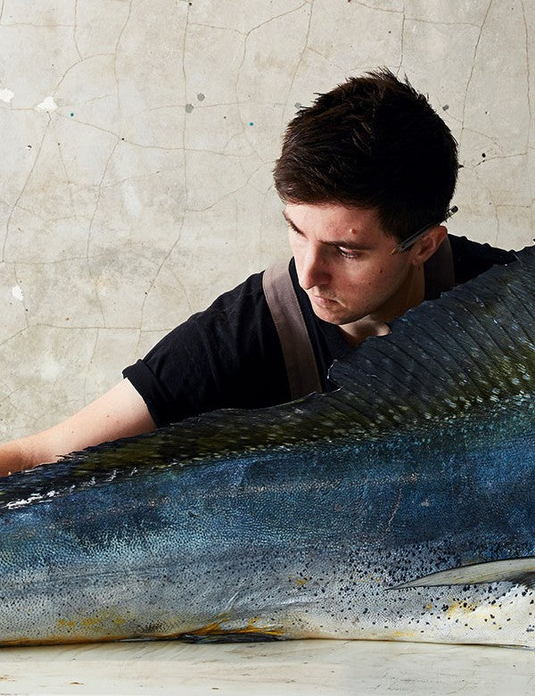Take One Fish by Josh Niland hardback cookbook — author Josh Niland with a whole fish