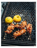 Backyard BBQ with Fire and Spice by Tony Ramirez hardback cookbook — page with charred citrus on the grill