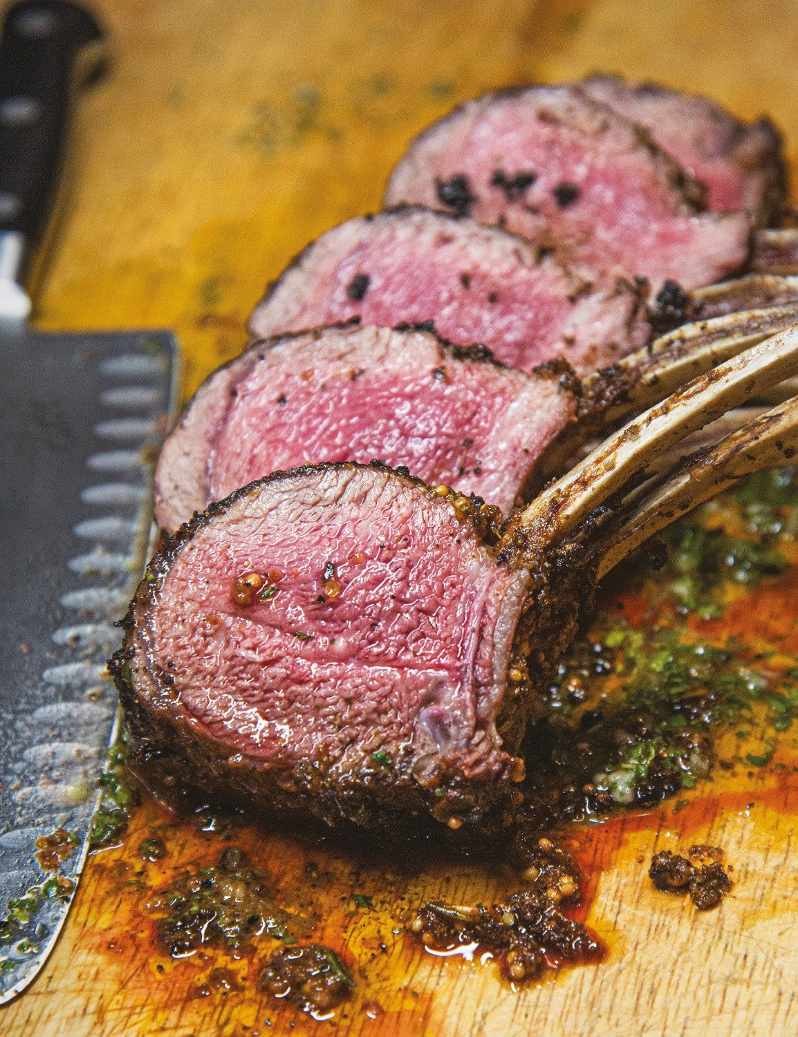 The Meathead Method by Meathead Goldwyn hardback cookbook — interior page of double-wide lamb rib chops with board sauce