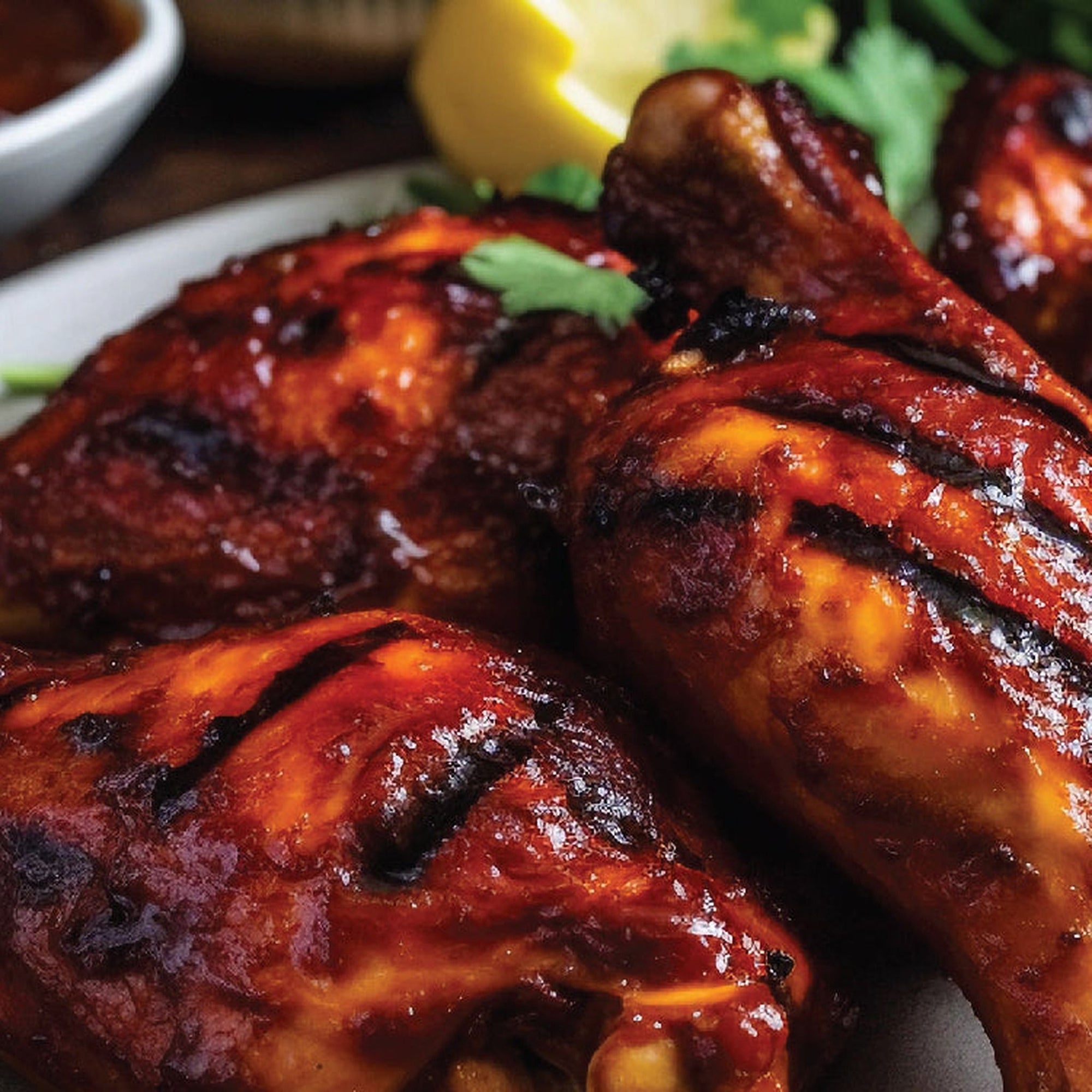 Chipotle Apple sauce glazed on grilled chicken drumsticks