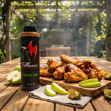 Tillman's Barbecue Chipotle Apple BBQ sauce — grilled chicken wings glazed with sweet-heat sauce on a garden table
