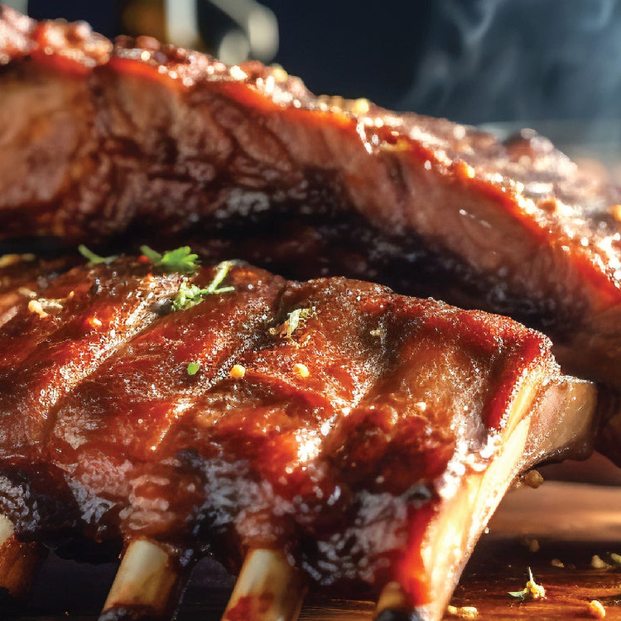 Smoked pork ribs glazed with Grandma's Red BBQ sauce