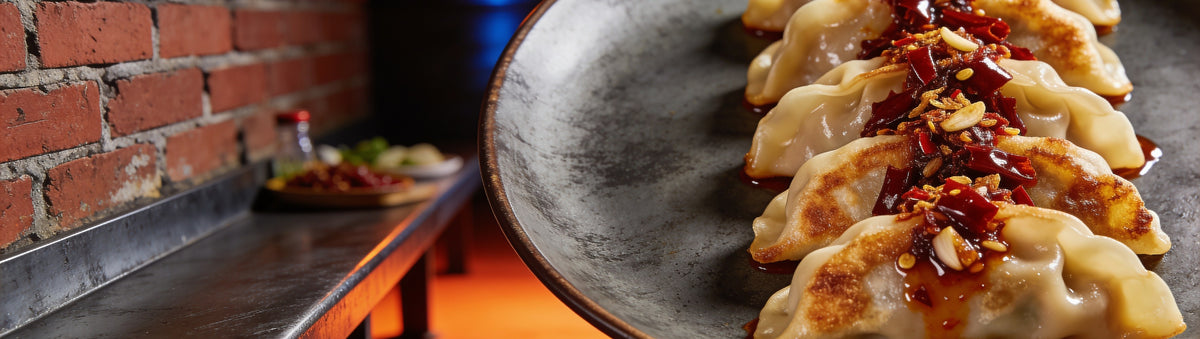 Pan-fried pork dumplings coated in extra hot crispy chilli oil - Uncle Mungo's Crispy Chilli Oil Extra Hot