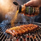 Big GCs Sweet & Savoury rub shaken onto pork ribs on the grill